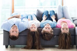 Comfort Lying Upside Down On Sofa Shutterstock 278189639
